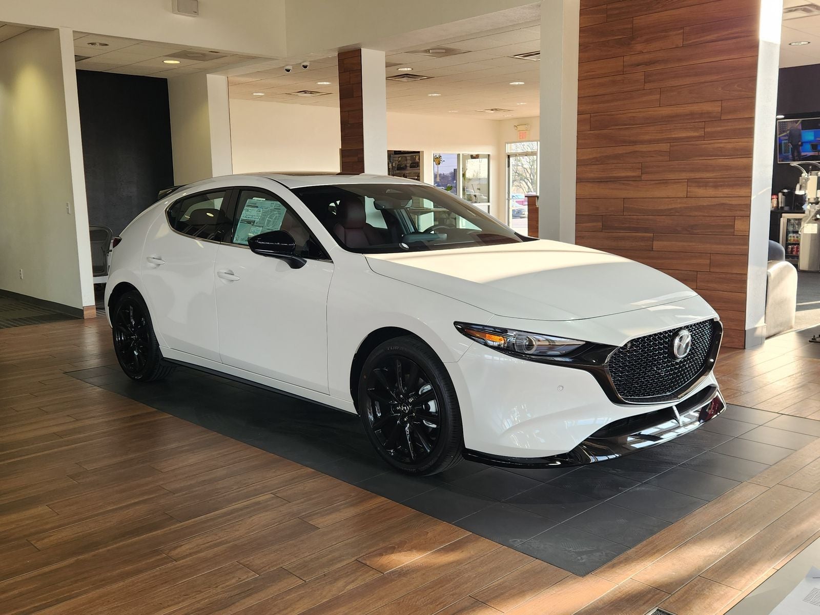 2026 Mazda Mazda3 Hatchback 2.5 Turbo Premium Plus in Snowflake White Pearl Mica — front three-quarter view
