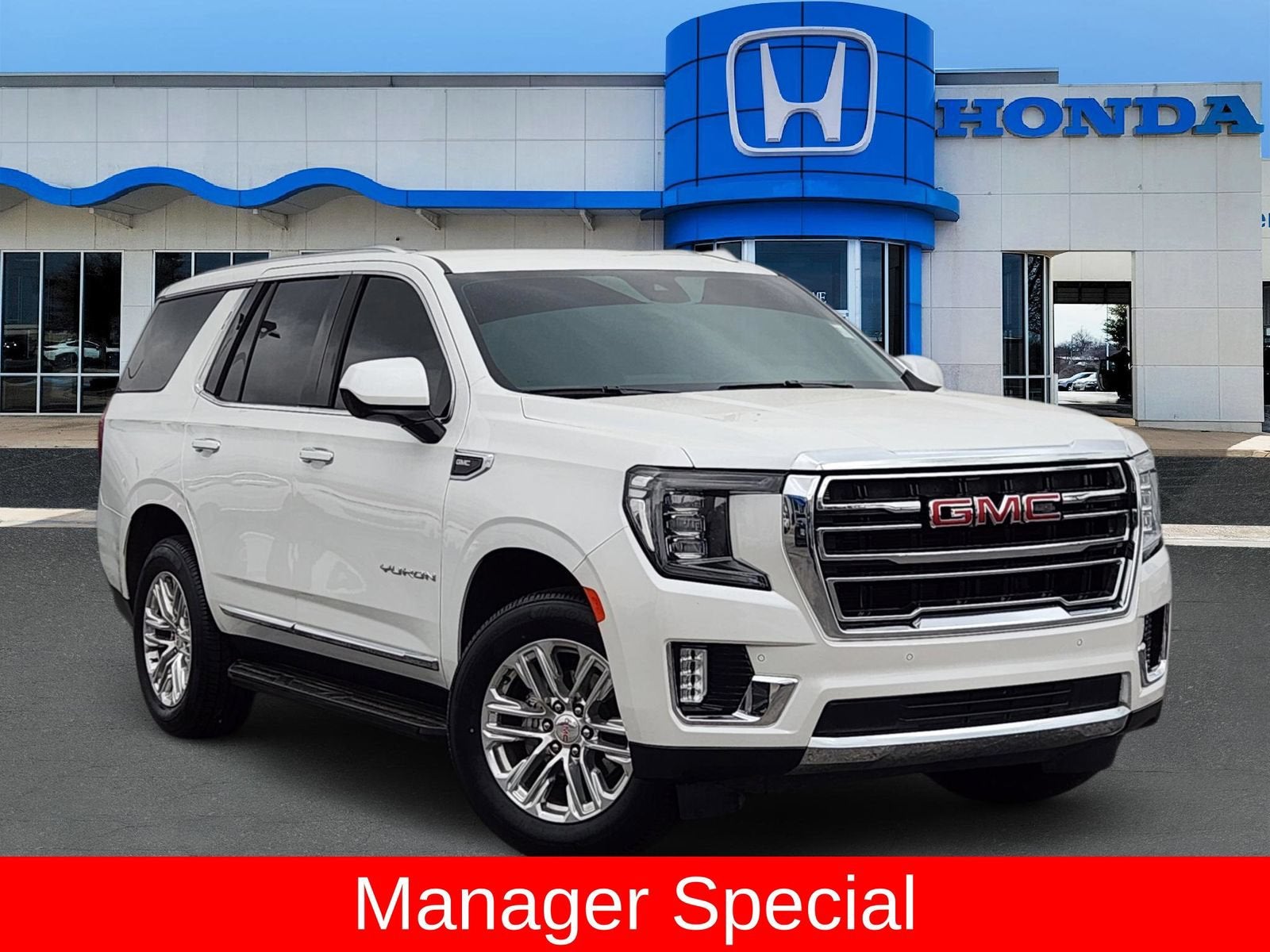 2024 GMC Yukon SLT in White Frost Tricoat — front three-quarter view